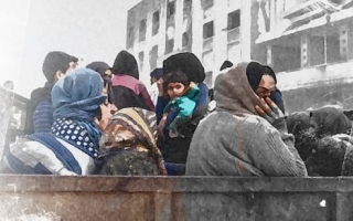 Syyrialaisia kuorma-auton lavalla