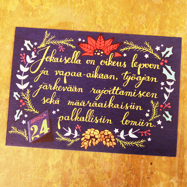 Artikla-joulukortti pöydällä