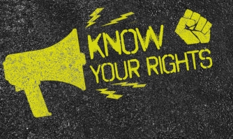On a dark grey background yellow text 'Know Your Rights' and a drawing of a megaphone.