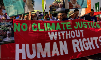 Mielenosoittajat vaativat ilmasto-oikeudenmukaisuutta Manilassa, Filippiineillä.